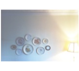 our little collection of 50 cent vintage plates around in a cloud of wall decor above our breakfast nook